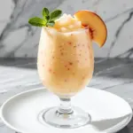 frozen peach bellini mocktail - featured image