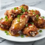 extra-crispy air fryer chicken wings with honey garlic glaze - featured image