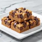 vegan peanut butter chocolate chip cookie bars - featured image
